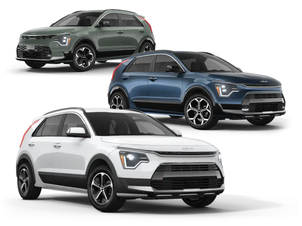 Three Kia Niro EVs in white, blue, and green are shown on a white background, angled to highlight their modern front-end design and LED headlights.