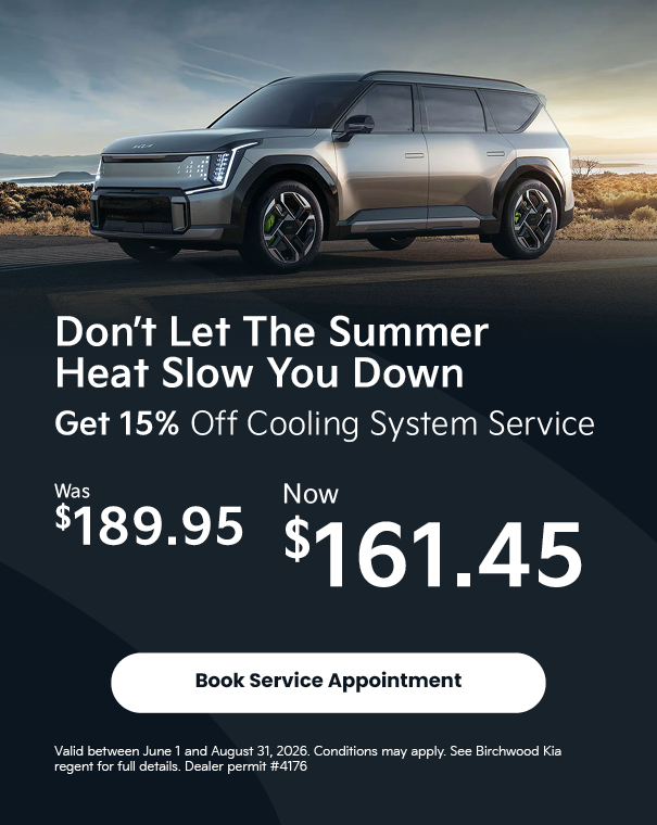 Sleek silver SUV on road at sunset with text offering 15% off cooling system service, discounted from $189.95 to $161.45, with a booking button.